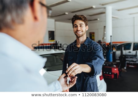 Stok fotoğraf: Auto Mechanic And Man Or Car Owner At Workshop