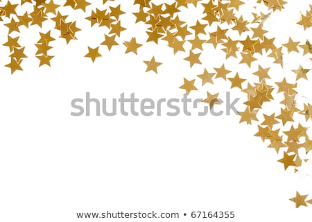 Stock photo: Christmas Decoration Of Colored Confetti Stars Against White Bac