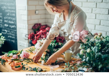 Foto stock: Woman Shopping In A Flower Shop