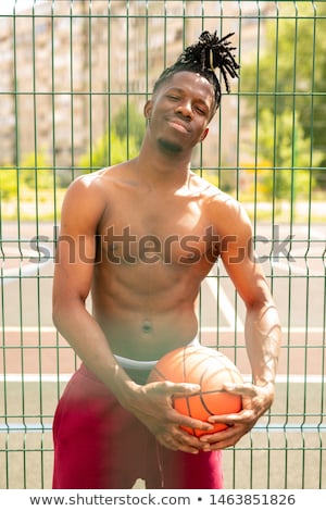 Stok fotoğraf: Happy Young Shirtless Basketballer Looking At You