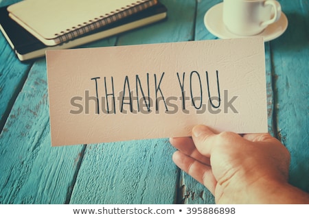 Foto d'archivio: Business Man Holding A Card With Thank You Text