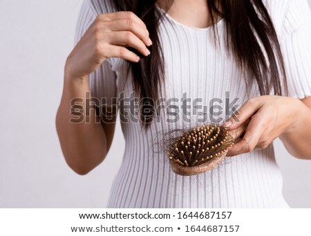 Foto stock: Woman Shows Her Beautiful Hair