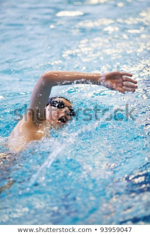 Stock photo: Boy Is Crawling In The Pool