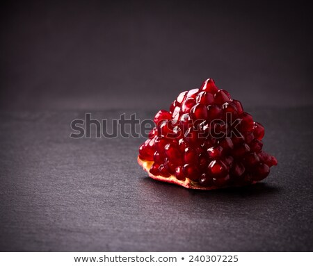 Сток-фото: Pomegranate On A Slate Plate