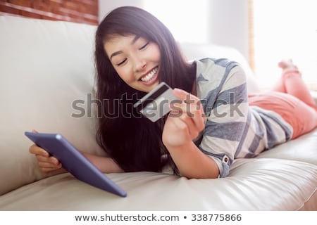 ストックフォト: Happy Asian Woman With Tablet Pc And Credit Card