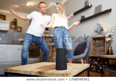 ストックフォト: Close Up Of Wireless Speaker In Front Of Couple