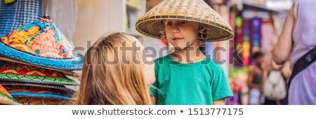 Stock foto: Mom And Son Travelers Choose Souvenirs In The Market At Ubud In Bali Indonesia Banner Long Format