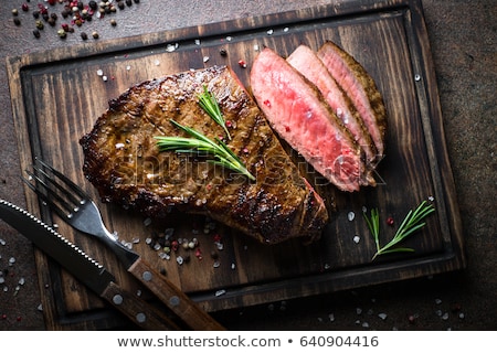 Stok fotoğraf: Fried Meat On The Grill