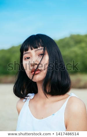 Stock fotó: Wind Woman With Tousled Hair At The Sea