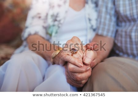 Foto stock: Senior Couple Holding Hands In Love