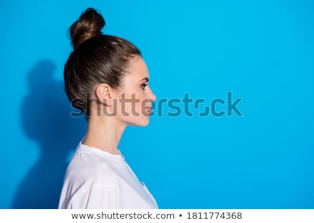 Foto stock: Woman With Nice Make Up And Hairstyle Is Looking To Her Side