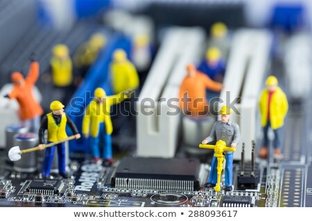 Stock foto: Team Of Engineers Repairing Circuit Board