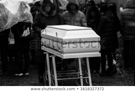 Foto d'archivio: Mourning People At Funeral With Coffin