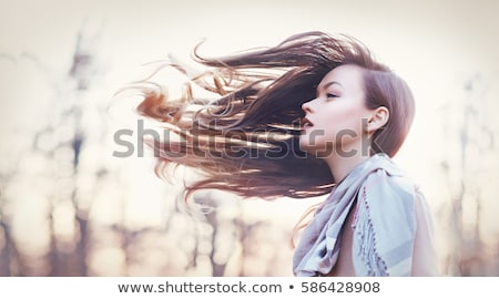 Stok fotoğraf: Portrait Of Beautiful Young Woman With Windy Hair