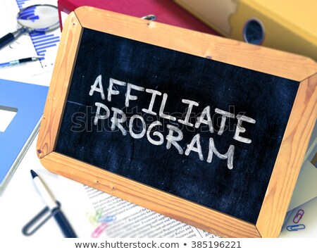 [[stock_photo]]: Affiliate Program On Office Binder Toned Image