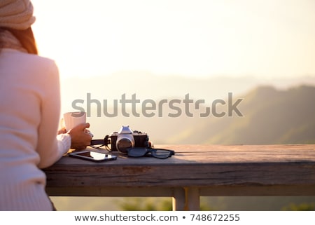 [[stock_photo]]: Woman On Balcony Drinking Tea