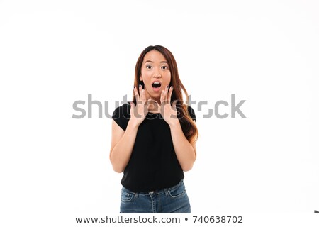 Stockfoto: Portrait Of Amazed Young Asian Girl In Black Tshirt Looking At