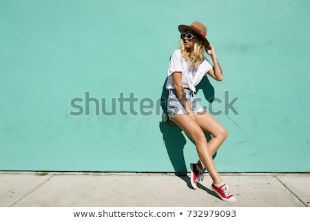 Foto stock: Young Woman In Jeans Shorts