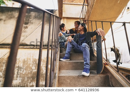 Stockfoto: Chatting With Friends In Urban Slums