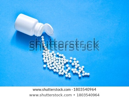 Zdjęcia stock: Pharmacy Antibiotic Pills In Spoon And Plastic Glass Of Water