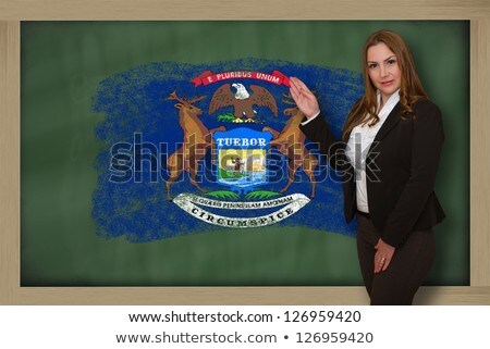 Teacher Showing Flag Ofmichigan On Blackboard For Presentation M [[stock_photo]] © vepar5