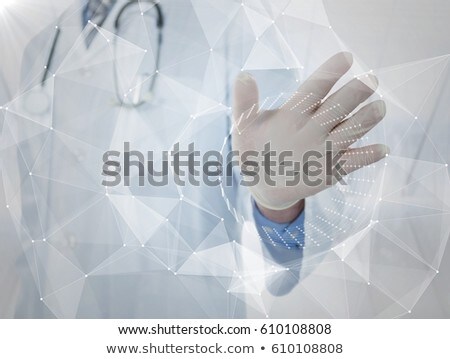 商業照片: White Interface With Flare In Front Of Doctor With Hand Out Against Blurry Window