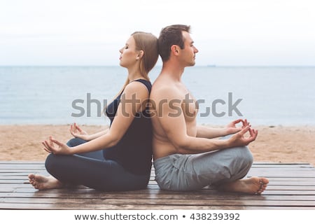 Stock photo: Healthy Man Doing Pilates Yoga Meditation On Beach Summer