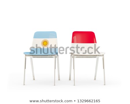 Foto d'archivio: Two Chairs With Flags Of Argentina And Indonesia