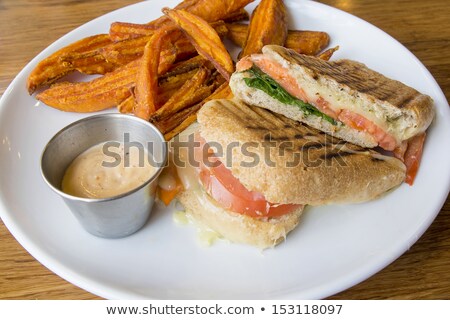 Stockfoto: Smoked Salmon Panini And Sweet Potato Fries