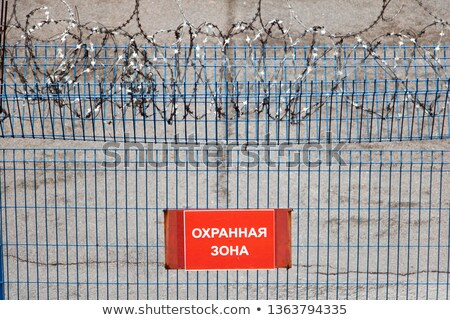 Stock photo: Security Fence In Russian Airport Text On Russian Forbidden Z
