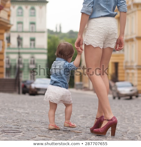 Сток-фото: Young Mother On Street With Tiny Daughter Girl