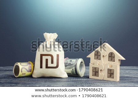 Foto stock: Israeli Shekel Money Bag And Puzzle House Housing Cooperative Membership Mortgage Loan On Purchase