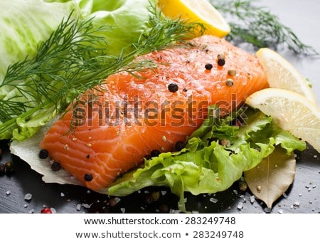 Foto d'archivio: Delicious Portion Of Fresh Salmon Fillet With Aromatic Herbs