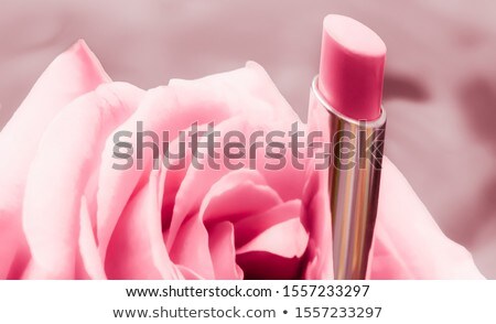 Stockfoto: Pink Lipstick And Rose Flower On Liquid Background Waterproof G