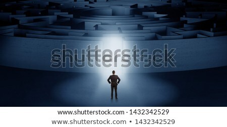 Foto stock: Businessman Starting A Concentric Labyrinth