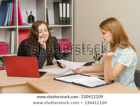 Foto stock: Head Closed Her Eyes In Shame Her Client Reads The Contents Of The Document