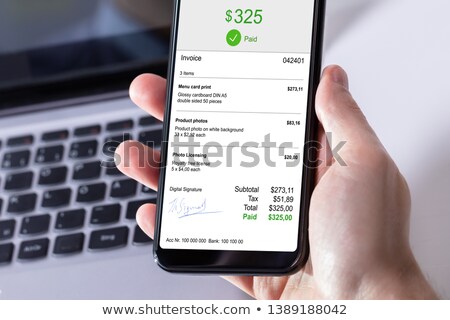 Stockfoto: Businessperson Paying Invoice On Mobile Phone