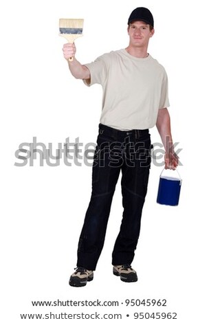 Foto stock: Craftsman Painter Holding A Brush And A Can