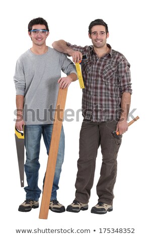 Stock photo: Builder Stood With Plank Of Wood