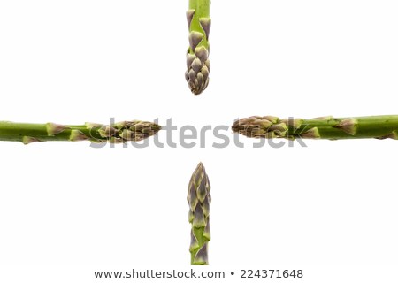 Four Green Asparagus Tips Pointing At Central Void Stockfoto © LeoWolfert