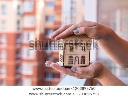 Сток-фото: Arm Holding Keys On Construction Site Background