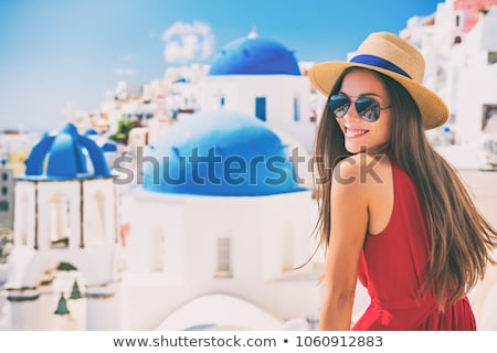 Stock photo: Greek Woman On The Streets Of Oia Santorini Greece