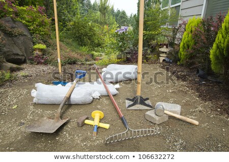 [[stock_photo]]: Excavating And Laying Pavers For Garden Patio