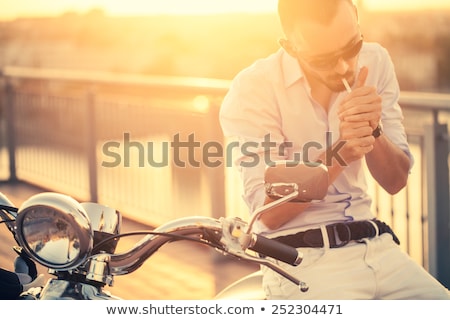 Stok fotoğraf: Young Man Smoking Cigarette With Copy Space