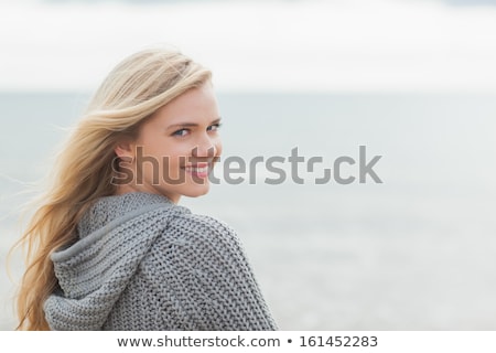 Stockfoto: Portrait Of A Beautiful Happy Woman In A Knitted Jacket