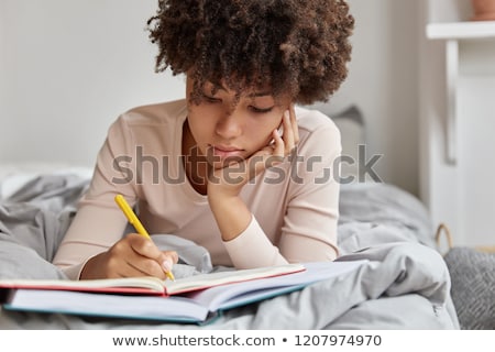 ストックフォト: Lying Down Woman With A Journal