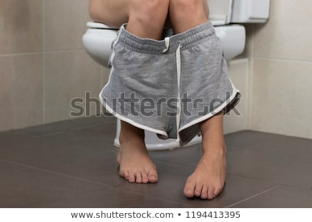 Stock foto: ädchen · sitzt · in · einer · Toilette