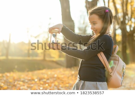 Stock fotó: Hourglass With Dry Leaves