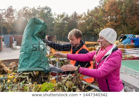 Woman At Recycling Centre Stockfoto © Kzenon