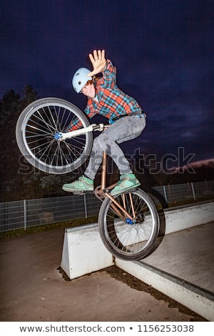 Foto stock: Boy Jumps With His Scooter Over A Ramp
